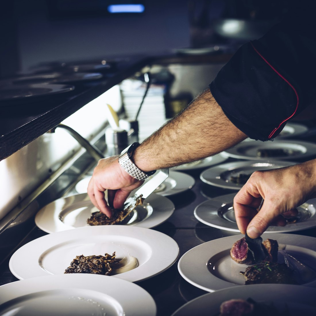 Hands at work at a restaurant pass